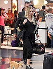 jennifer-lawrence-with-her-dog-at-jfk-airport-in-new-york-october-29-2016_830080646.jpg
