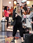 jennifer-lawrence-with-her-dog-at-jfk-airport-in-new-york-october-29-2016_930080646.jpg